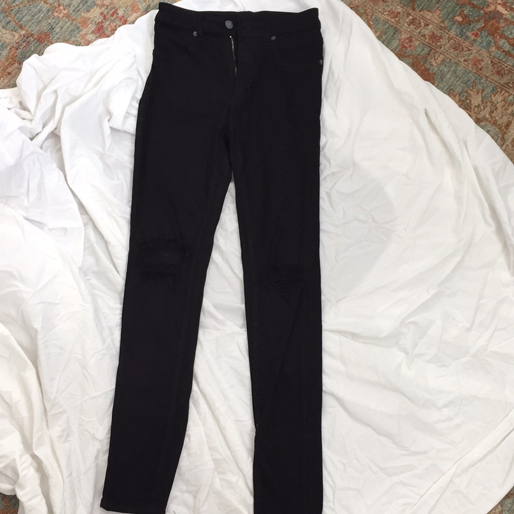Black carmar jeans with ripped knees